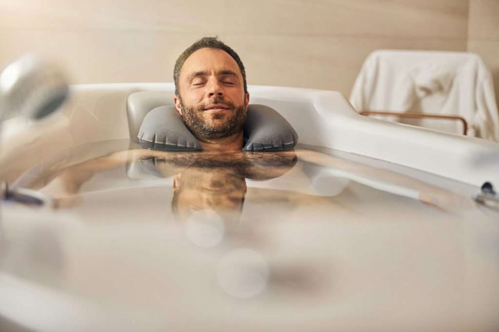 A gentleman relaxes in a spa bath after a long day at the African Mining Indaba. 